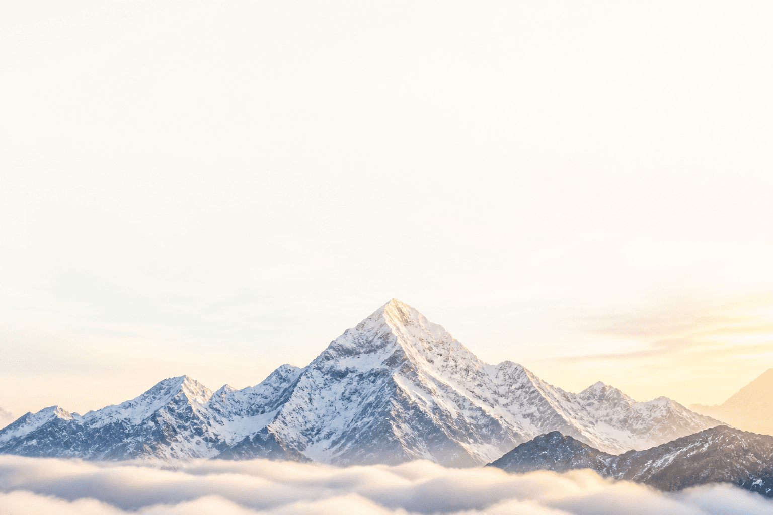 Himalayan mountain summit above morning clouds